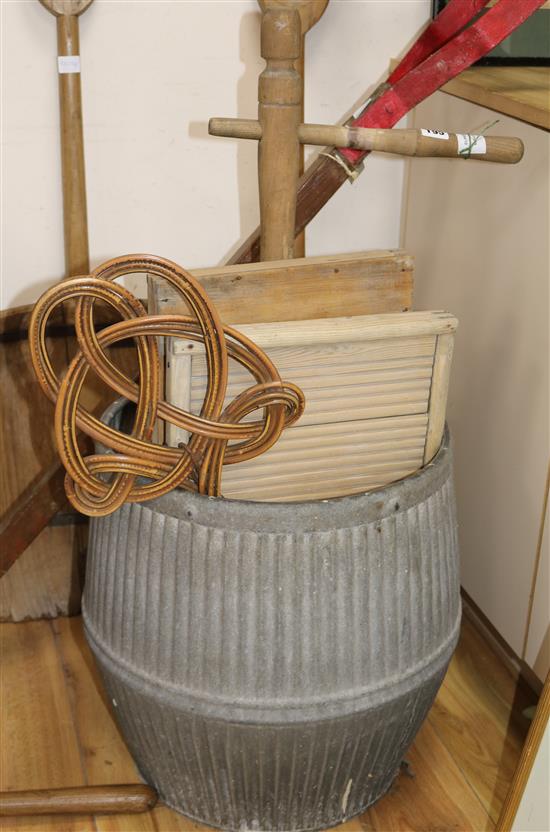 A galvanised tin wash barrel, a washing dolly and two wash boards